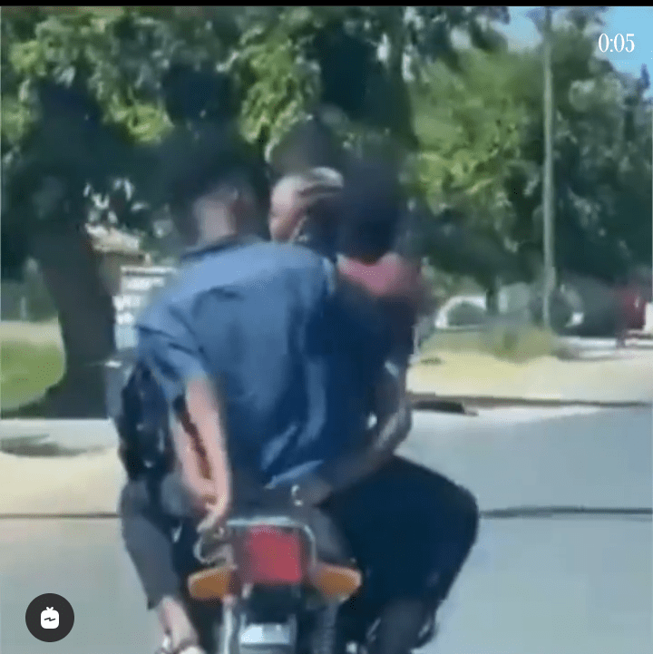 Couple spotted kissing on a moving motorcycle