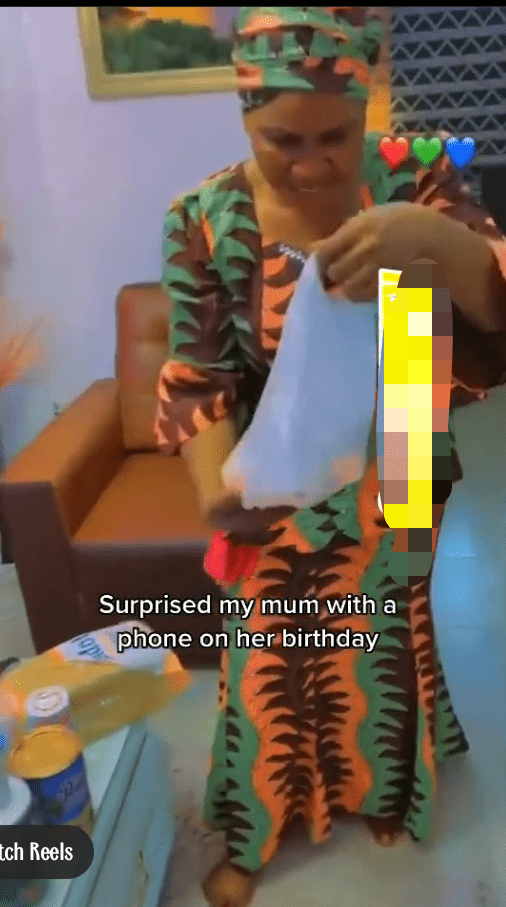 Woman rolls on the floor in excitement after receiving a phone from her son (Video)