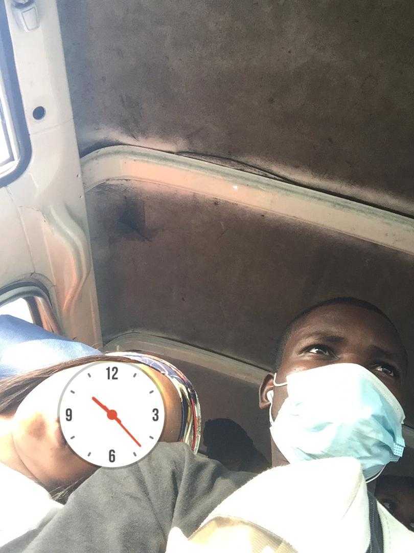 Man faces heavy criticism after sharing photo of lady who slept off on his shoulder while in a bus