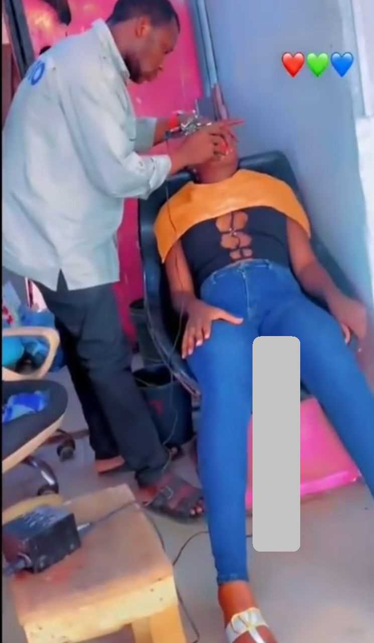 "That friend is not a good person" - Lady mocked over tattooed 'pink lips' procedure (Video)