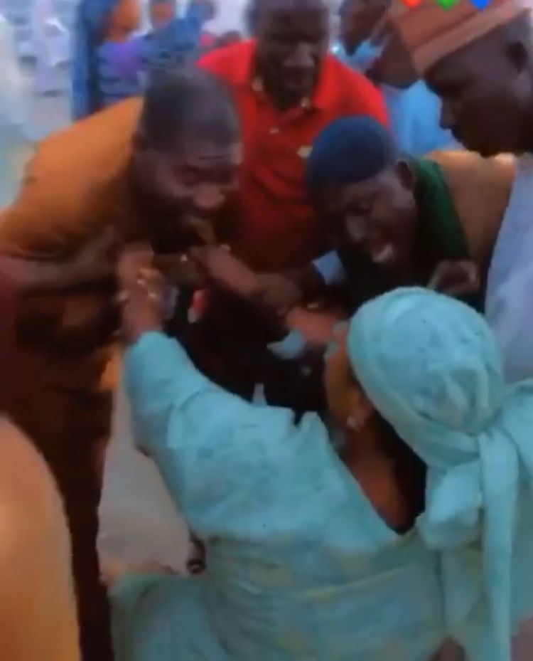 First wife creates scene after being pushed by husband during wedding to second wife (Video)
