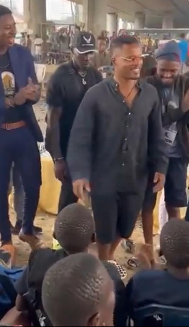 Manchester United star, Patrice Evra visits Oshodi underbridge (Video)