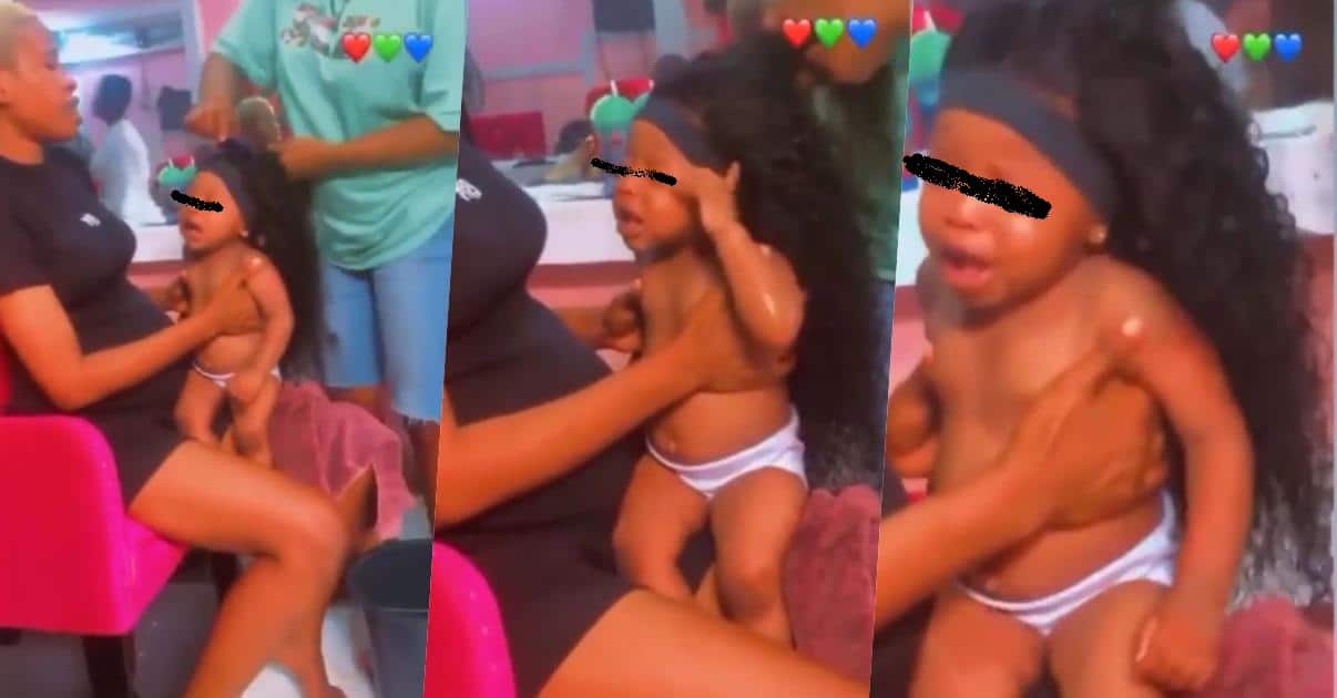 "So many untrained children making children" - Reactions as lady installs wig on baby's head (Video)