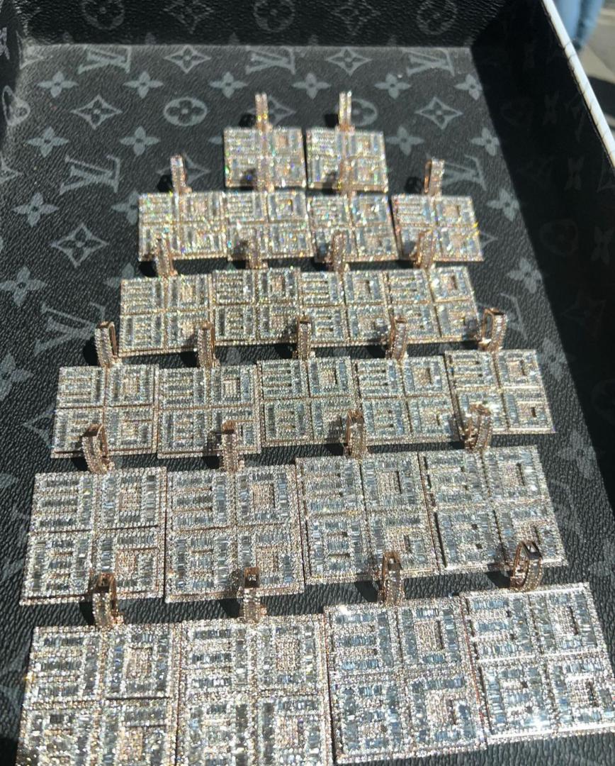 Davido flaunts customized diamond pendants for crew members (Video)