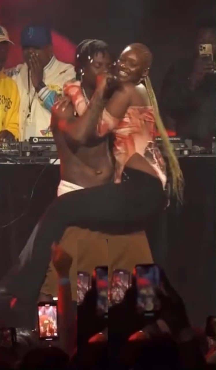 "Jealousy was written all over the faces of others" — Reactions as Rema lifts female fan (Video)