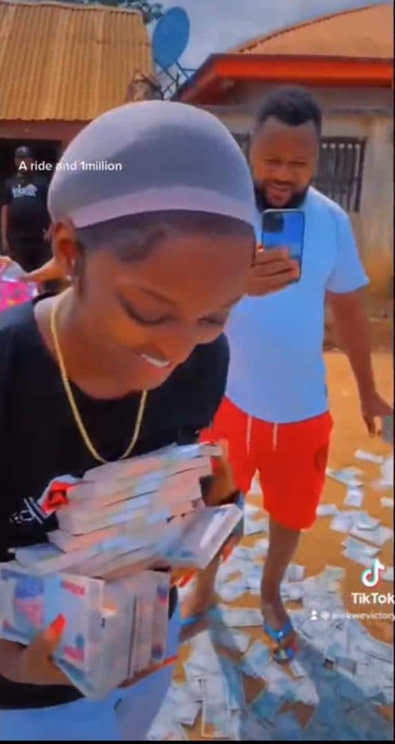 Lady gushes as boyfriend gifts her N1M cash and new car (Video) 