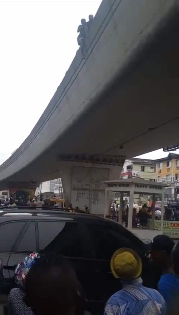 Onlookers save man with smart move while attempting to jump off bridge in Lagos (Video)