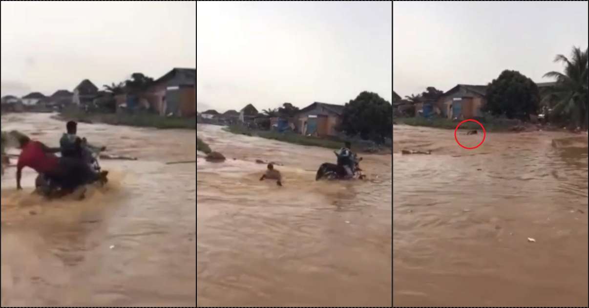 Onlookers stare helplessly as flood washes away man and bike (Video)