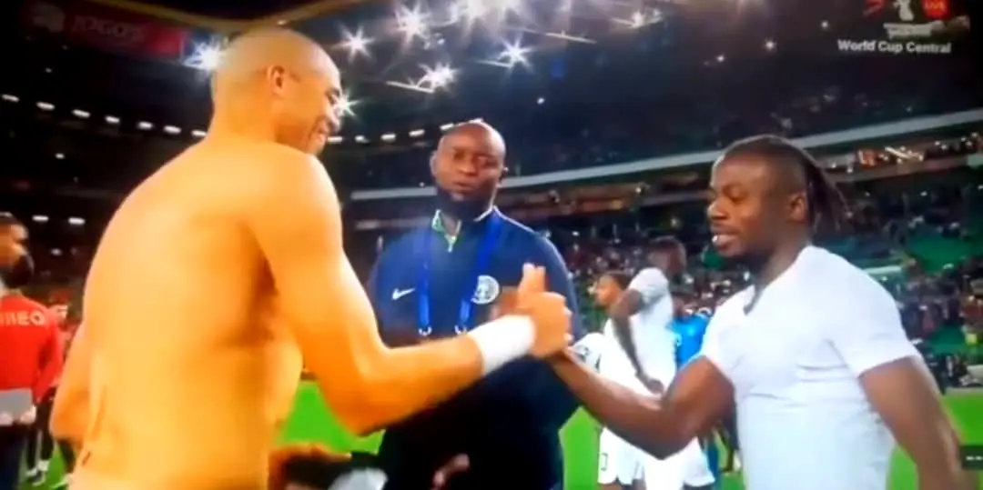 Super Eagles assistant coach Finidi George lobbying for Pepe’s jersey with Moses Simon after Nigeria's 4-0 defeat to Portugal