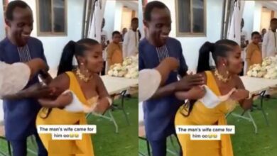 Moment wife rushes in to rescue husband from overzealous wedding guest (Video)