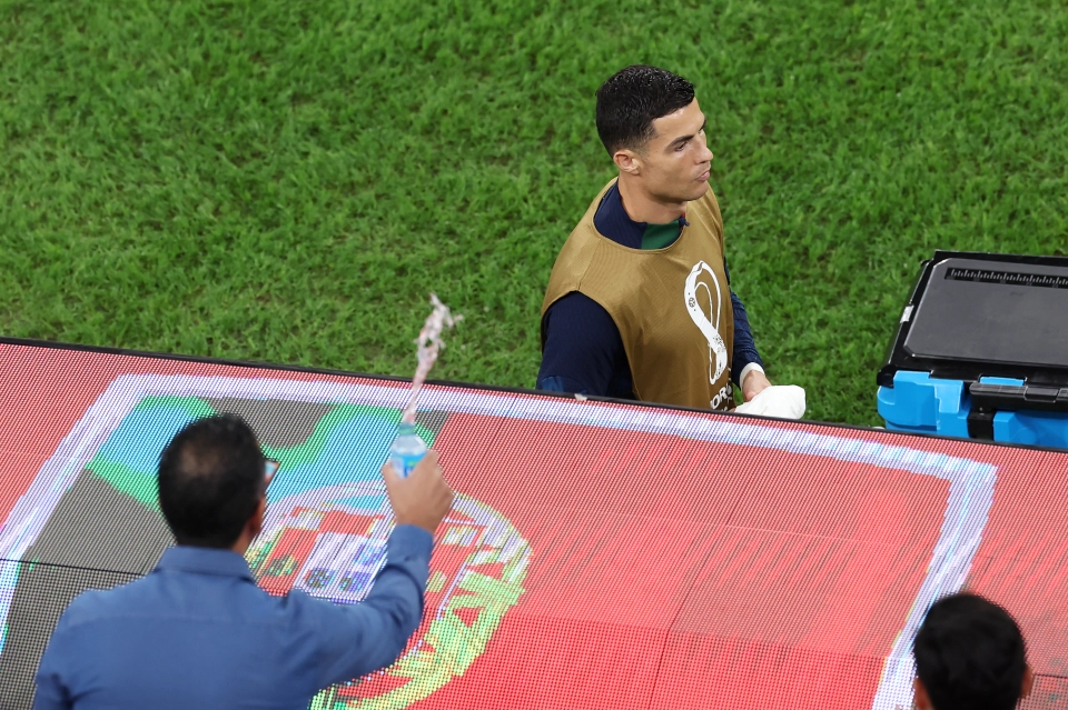 A fan was thrown out during Portugal's match against Morocco for throwing water on Cristiano Ronaldo