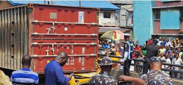 Nine passengers dead as container falls on a bus in Lagos (Video)
