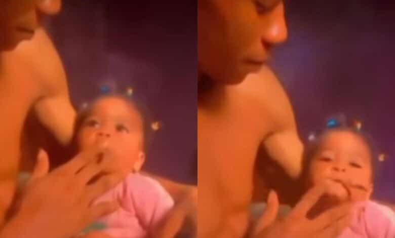 Shock as mother records while father feeds their baby with weed (Video)