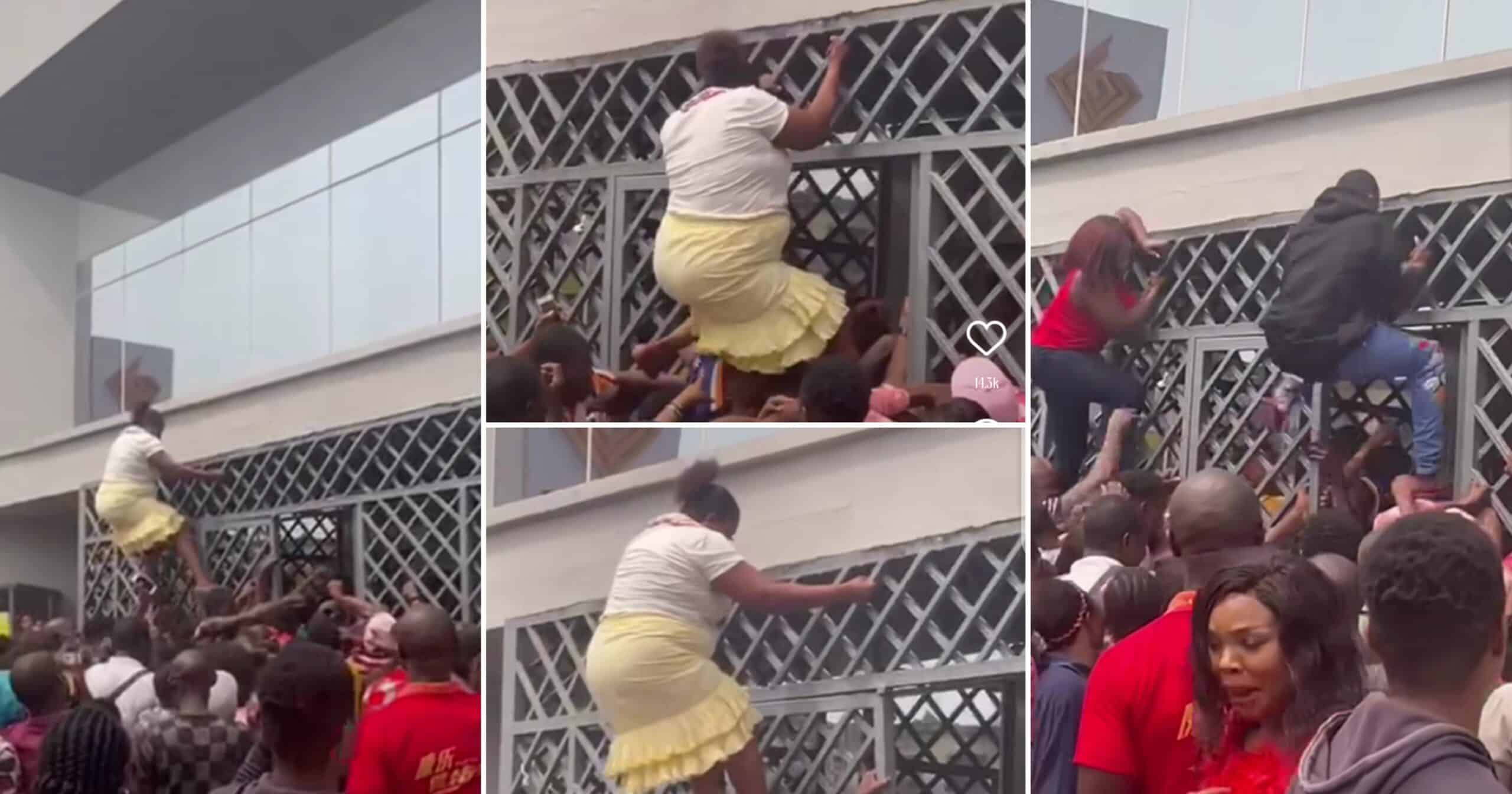 "Nigeria turn her to spiderman" Nigerian woman climbs bank gate