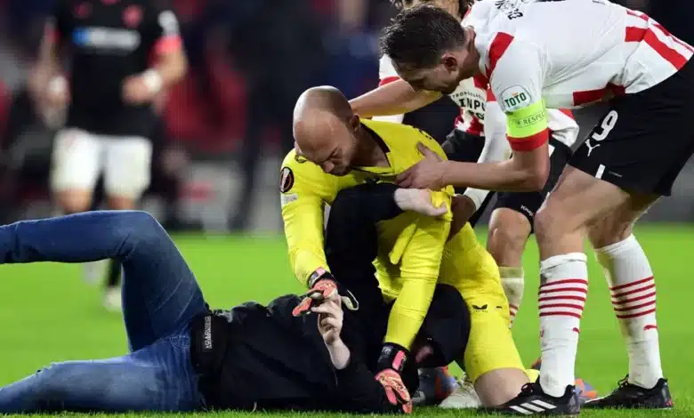 Sevilla goalkeeper Marko Dmitrovic attacked by fan after defeat to PSV