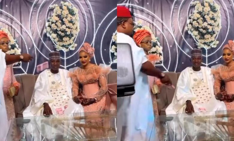 Wedding guest spraying money on couple in a 'rare' manner becomes talk of town (Video)