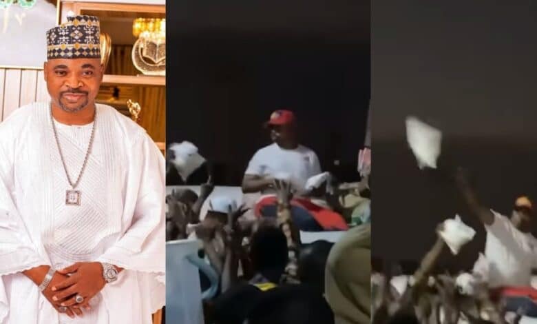 MC Oluomo sharing small bags Garri Lagos