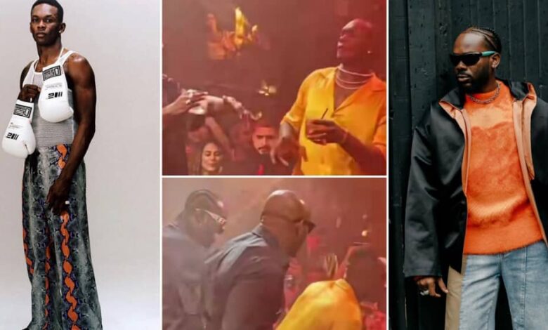 Isreael Adesanya captured celebrating wins with Adekunle Gold and other in a club