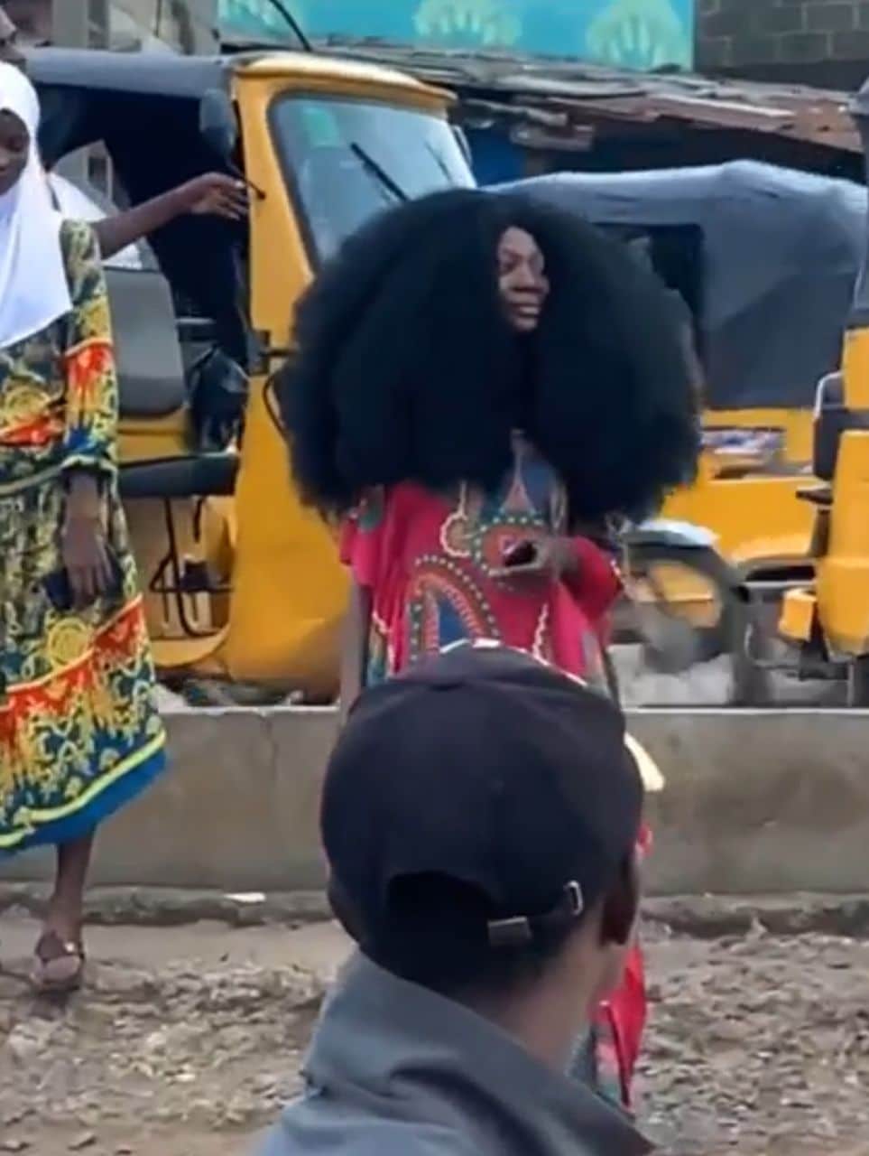 Drama as lady with unique hair size causes standstill (Video)
