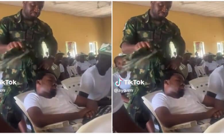 Soldier seen fanning two corps members sleeping during an NYSC program (Video)