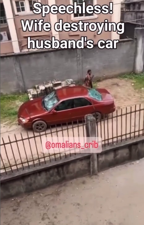 Nigerian lady destroys husband's car with a stone
