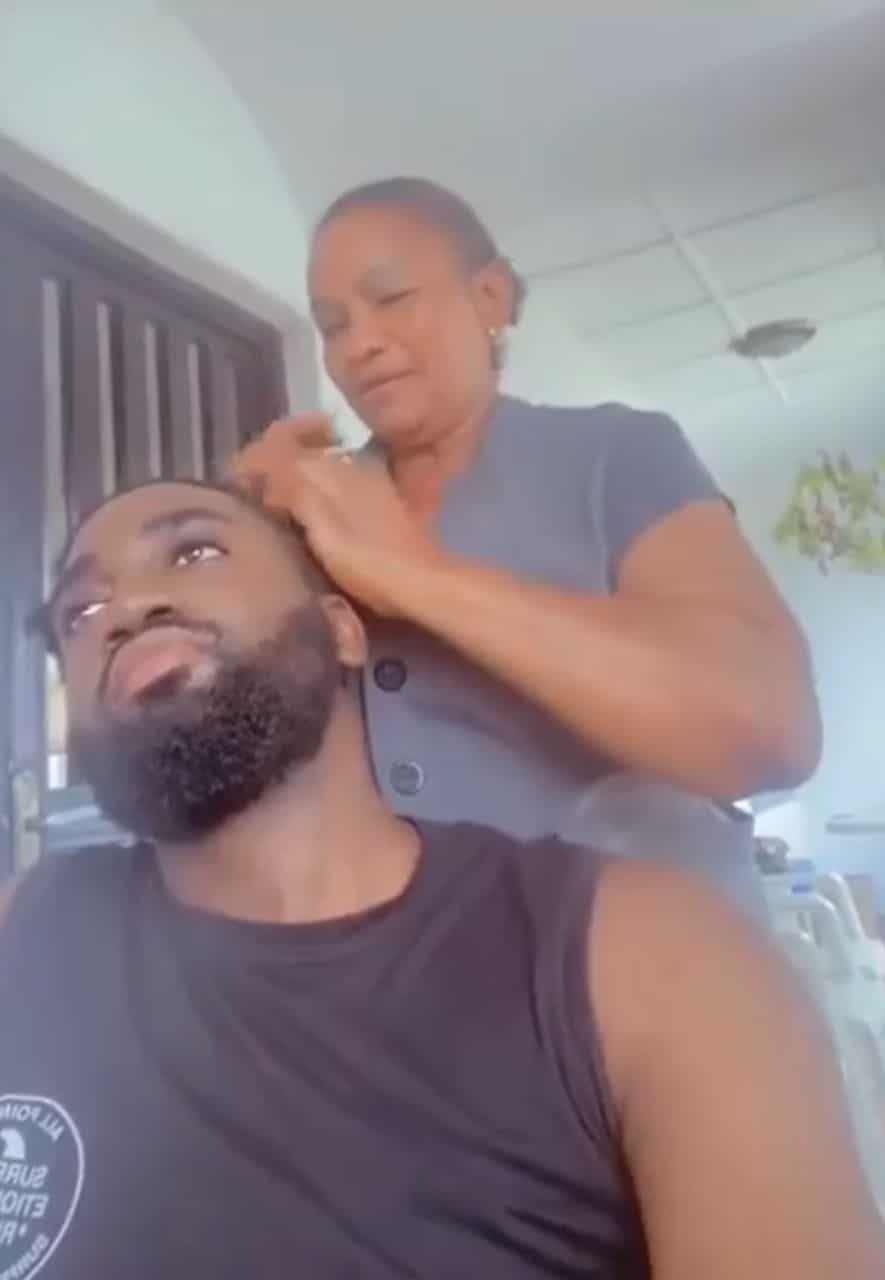 Adorable moment mother plaits grown son's hair (Video)