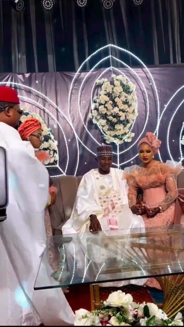 Couple speechless as businessman rains bundles of new notes on them at their wedding (Video)