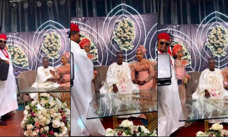 Couple speechless as businessman rains bails of money on them at their wedding (Video)