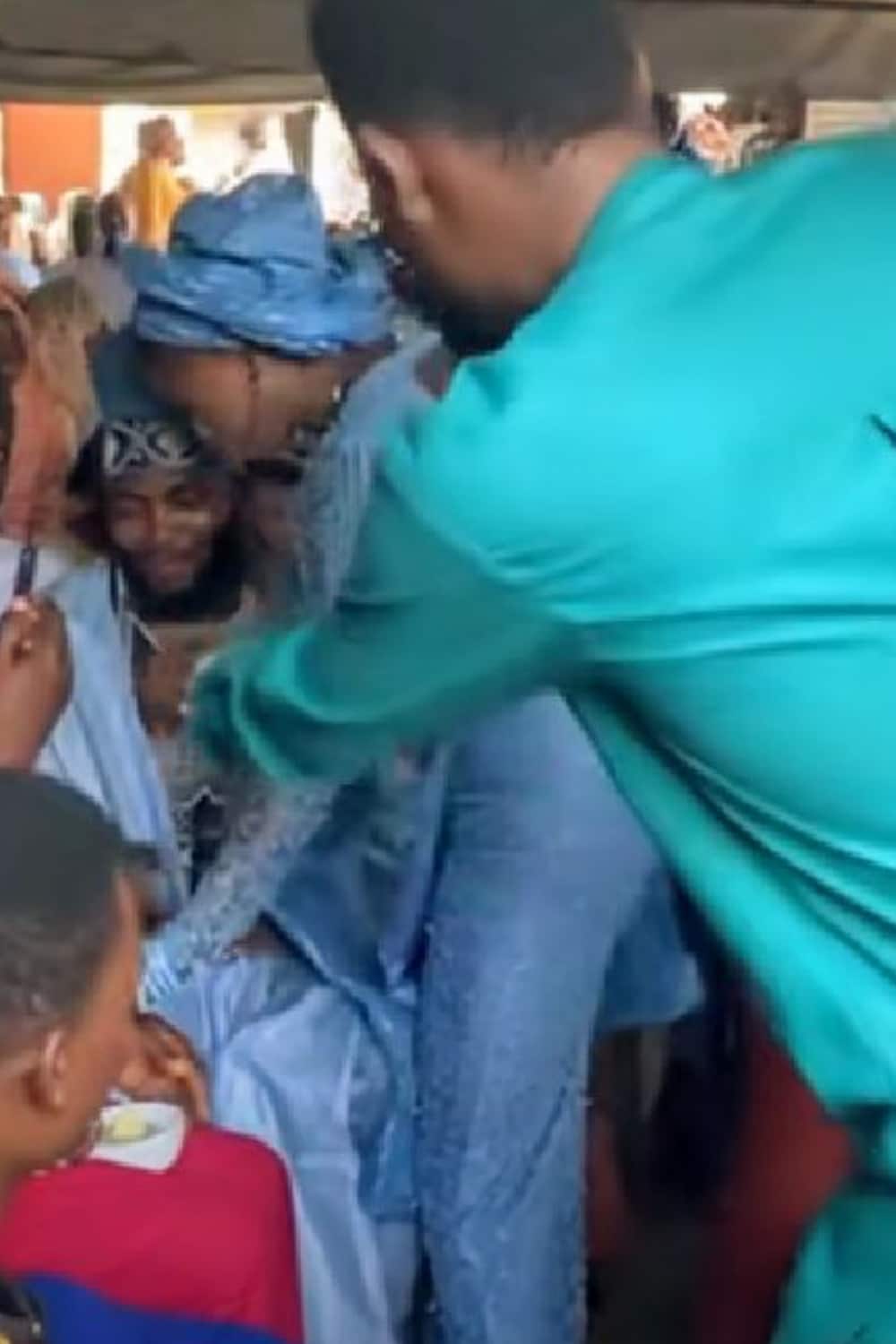 "Hilarious moment"- Nigerian bride takes away food from foodie groom eating at his own wedding (video)