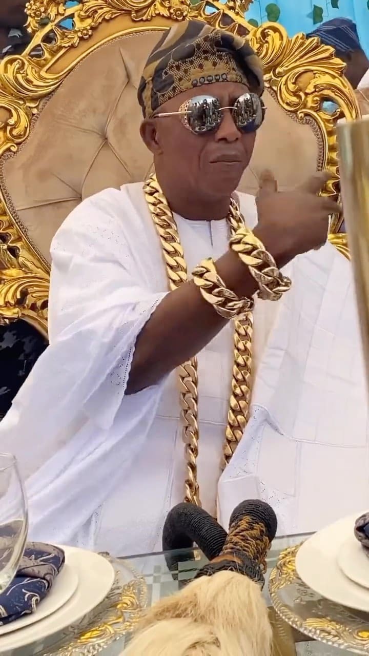 Oniba of Iba Ekun stirs reactions as he rocks gold jewelries worth millions of naira (Video)