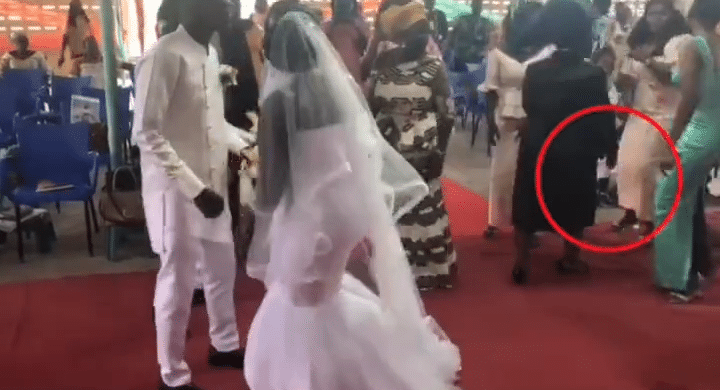 Moment pastor's wife spanked lady for dancing 'inappropriately' at wedding (Video)