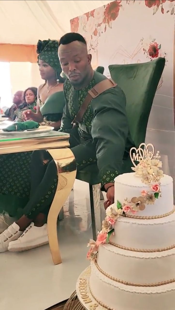 Moment groom couldn’t hold back from eating cake at his own wedding (Video)