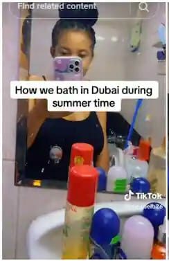 "This is how we bath in Dubai" - Nigerian lady reveals ice block bathing saves them from hot weather