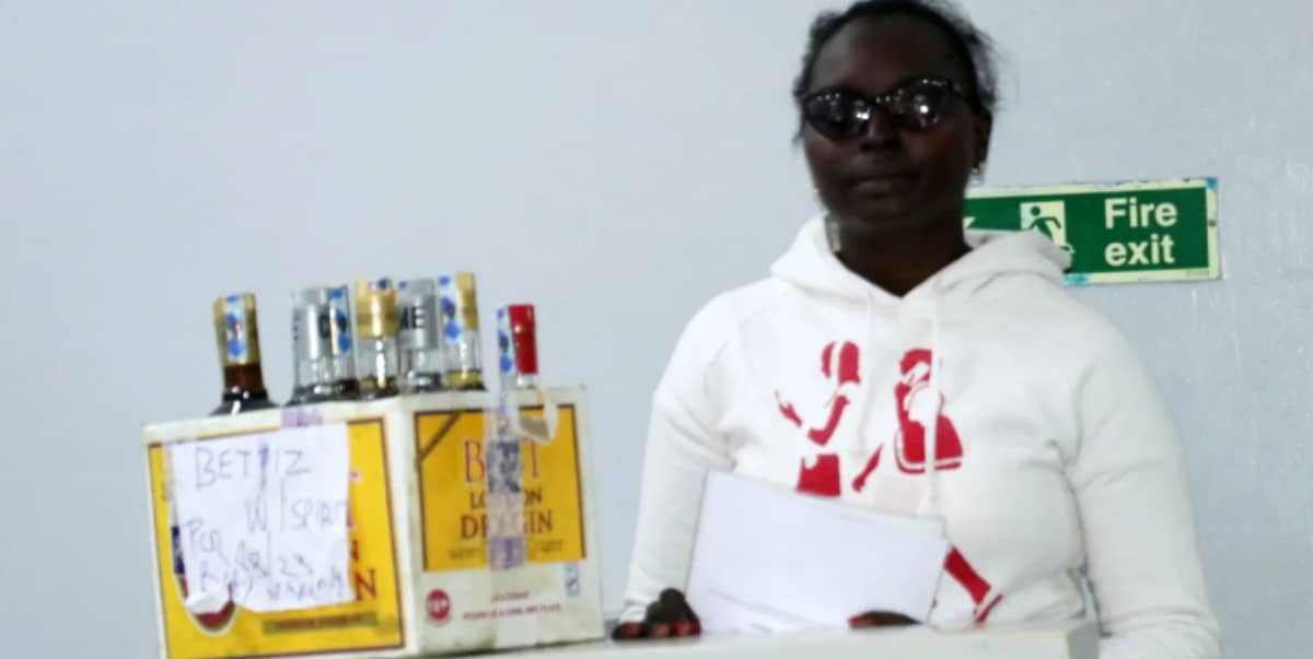 Woman arrested for failing to display 'alcohol not for sale to persons under 18' sign at liquor store