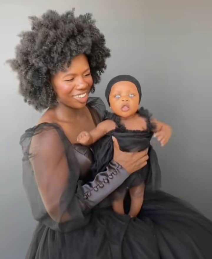 Mum poses with her blue eyed baby