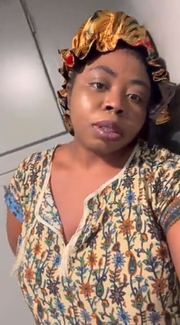 Lady climbs kitchen countertop to escape pet pitbull. 