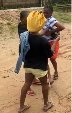 Victims gang up to beat up lady who used their "contribution money" to buy iPhone 13 (Video)
