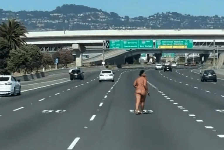 Naked woman gets out of her car, then fires gun on busy bridge during rush hour (Video)