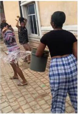 Lady disgraces young sister for wearing short dress to church, pours water on her 