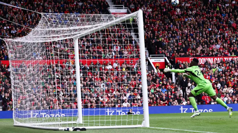 Andre Onana reacts after being scored from halfway line on Old Trafford debut