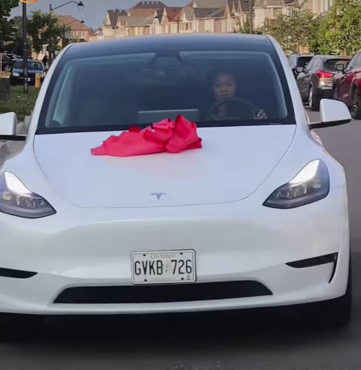 Happy husband splashes over N50 million on wife, buys her a Tesla model Y SUV as push gift.