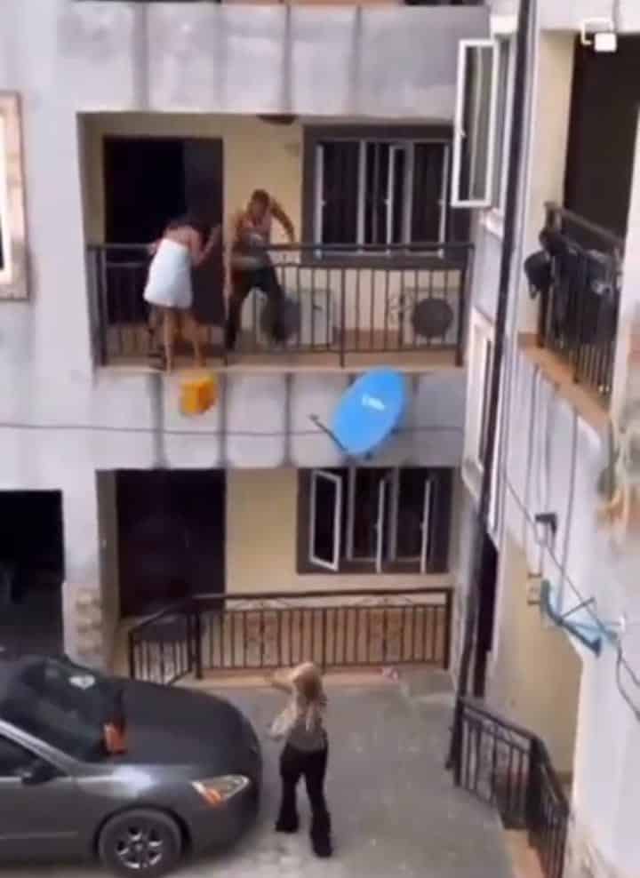 Side chic tries to jump down from building as lover’s wife returns unaware