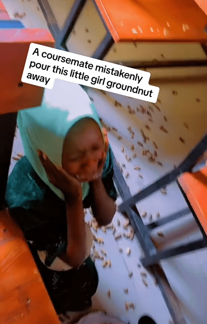 Little girl hawking groundnuts