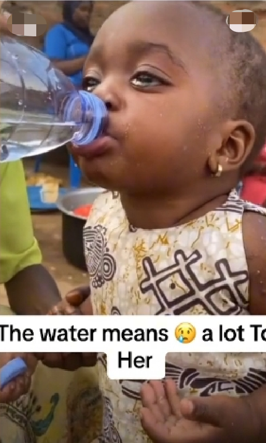 Little girl drinking water