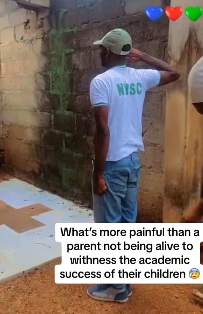 With tears, corper pays respect to late parent's grave after completing NYSC (Video)