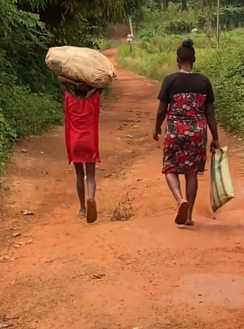 Man fumes after seeing heavy load given to a young girl to carry on her head (Video)