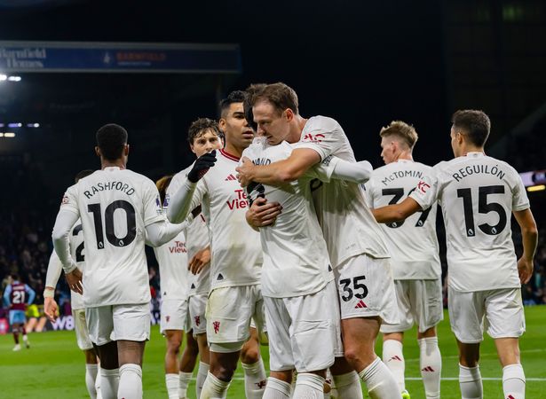 Bruno Fernandes gives his Man of the Match award to Jonny Evans 