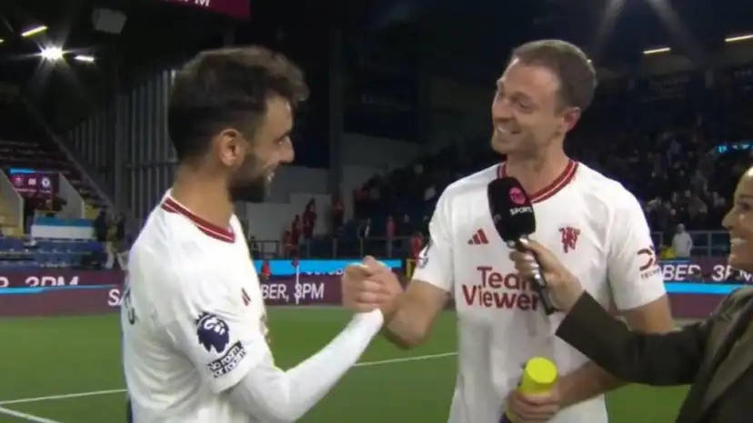 Bruno Fernandes gives his Man of the Match award to Jonny Evans