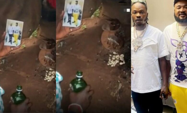 Mohbad's fan takes Naira Marley and Sam Larry's photo to shrine