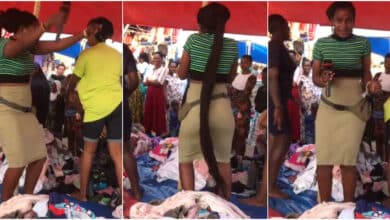 Lady selling second hand clothes in market causes buzz as she sings, shakes waist to attract customer (Video)